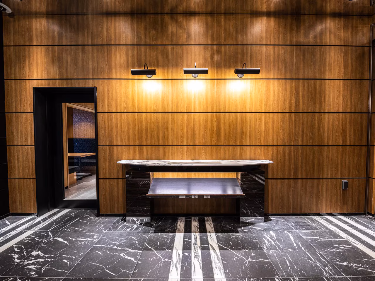 APA Hakata Ekihigashi lobby with high-ceiling atrium and check-in kiosk row