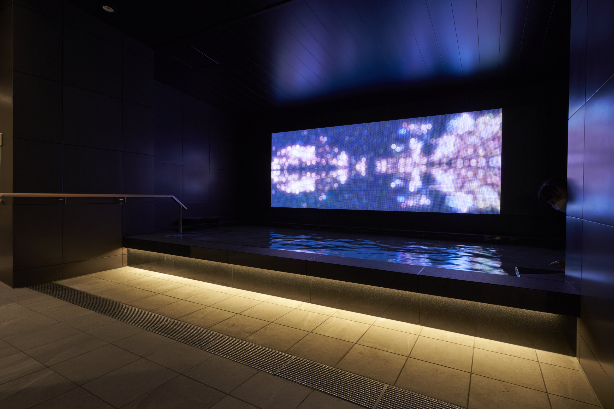 Cross Life Hakata Tenjin free public bath (sentō) featuring evolving digital art installation