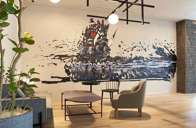 Cross Life Hakata Tenjin 360° HUB lobby lounge with co-working seating and natural light