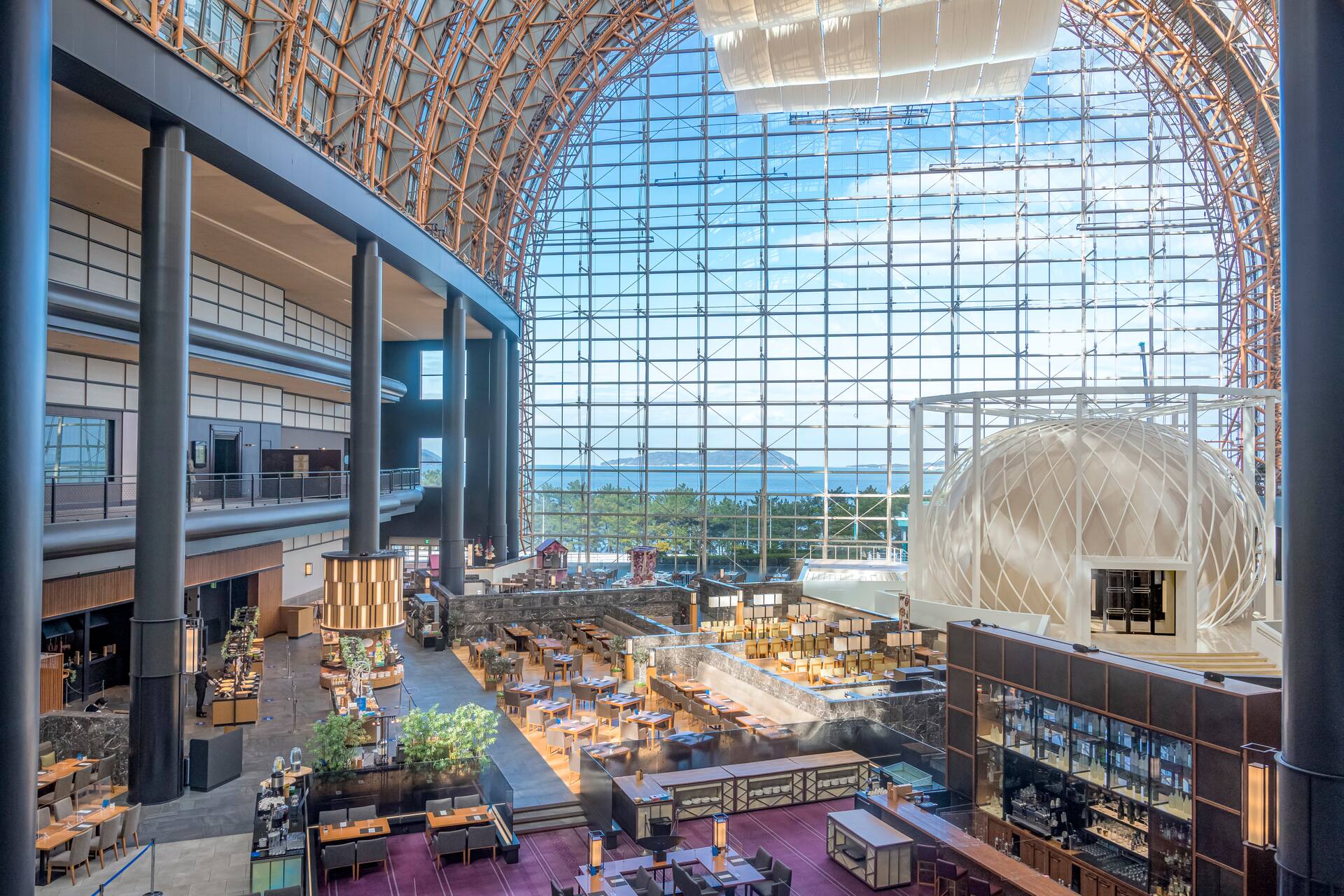 Seala Brasserie atrium dining room with 40-meter glass ceiling and breakfast service