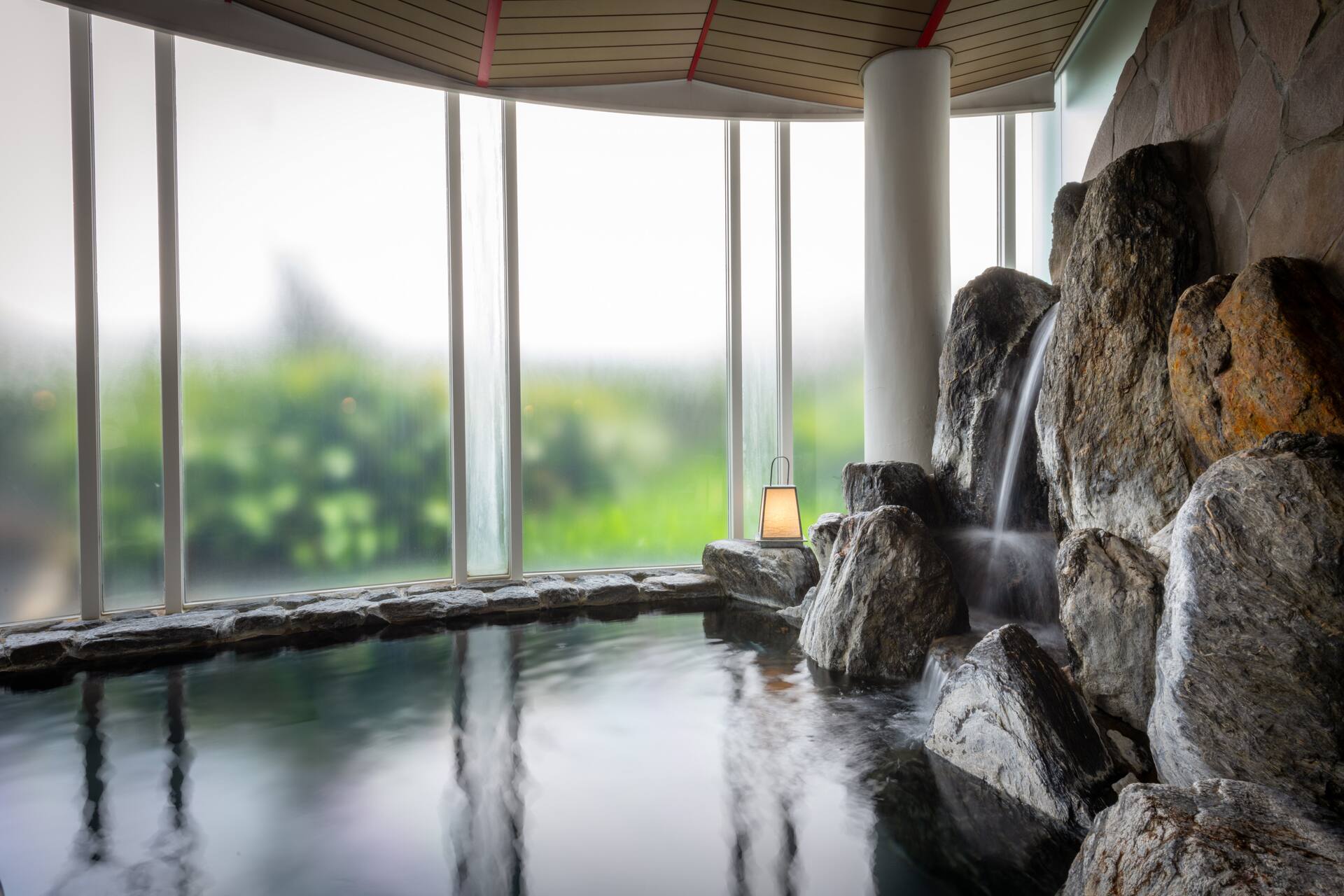 Iwoburo Japanese stone public bath with natural light from skylight