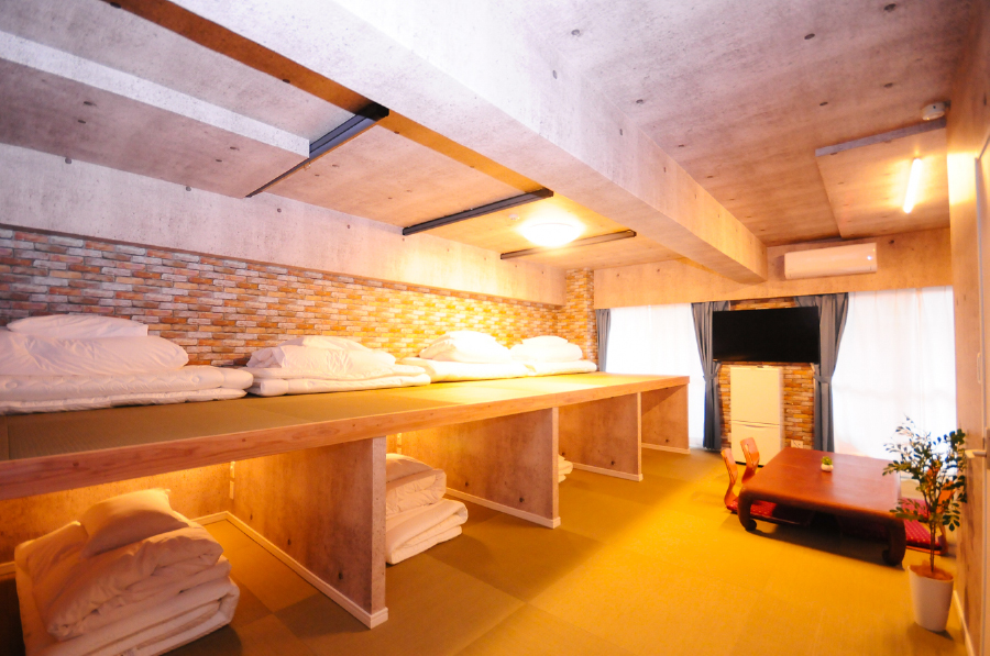 Hotel Japanesque Fukuoka Japanese-style tatami dormitory room with futon beds