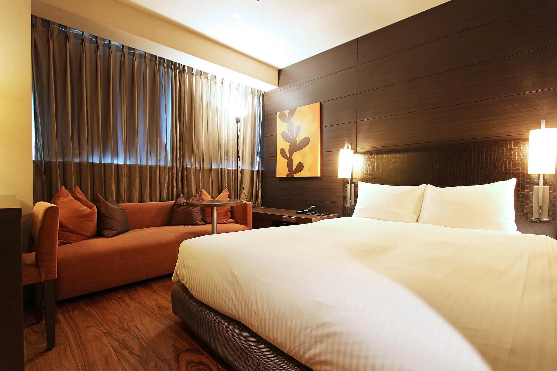 Superior Double room at KOKO HOTEL Fukuoka Tenjin — larger footprint with sofa seating area and warm wooden tones