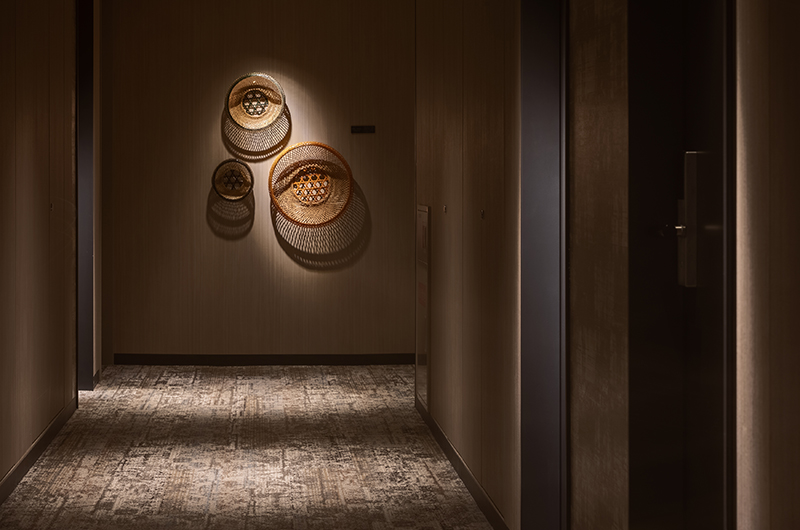 Guest room corridor at Mitsui Garden Hotel Fukuoka Gion with curated wall art reflecting Hakata heritage