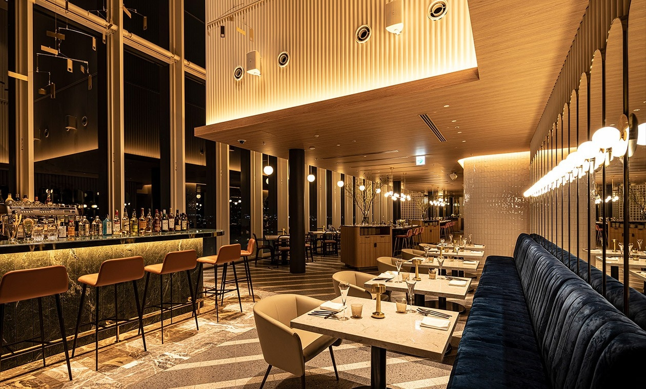 Le Ciel Bleu restaurant at Miyako Hotel Hakata with elegant table settings and ambient lighting