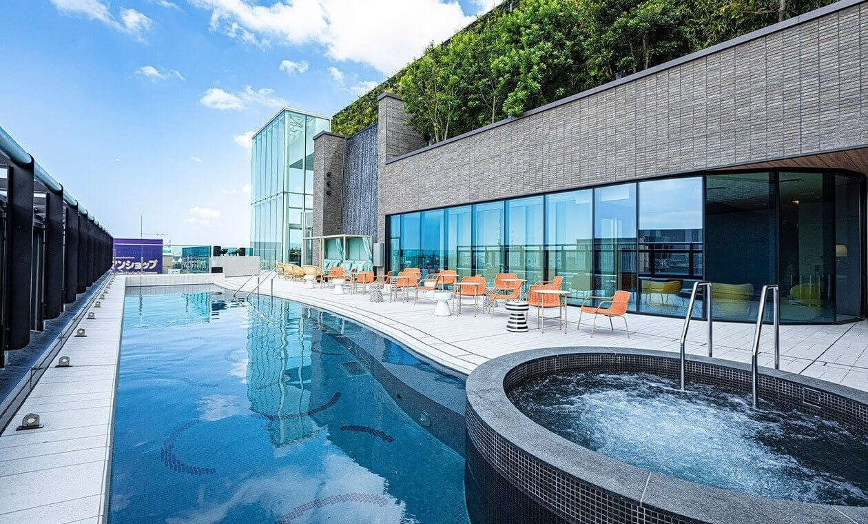Rooftop outdoor hot spring onsen at Miyako Hotel Hakata with city skyline visible