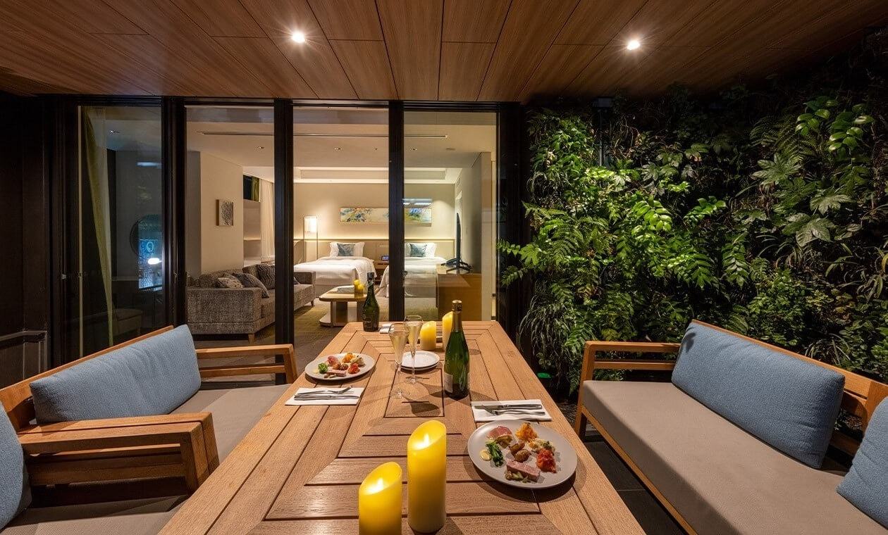 The Terrace room category at Miyako Hotel Hakata with panoramic window and lounge chair