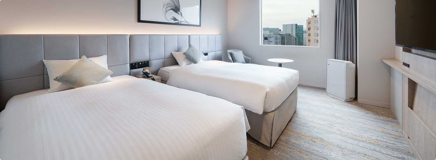 Moderate twin room at Oriental Hotel Fukuoka Hakata Station, approximately 21 sqm