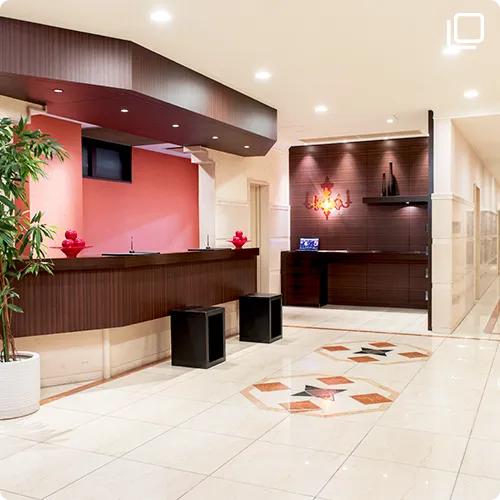 Ground-floor lobby with the 24-hour espresso station and amenity rack